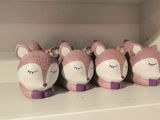 five little ceramic animals that are sitting on a shelf