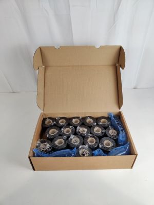 many rolls of tape in a box on a white surface