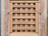 a close up of a picture of a window with a wooden frame