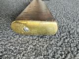 a small brass object on the carpet of a room