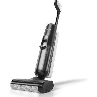 un gros plan d'un aspirateur noir et argenté posé sur une surface blanche