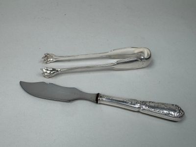 two knives and a knife on a table