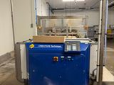 a blue machine that is sitting in the middle of a room