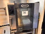 an unox oven with a tray of food inside of it