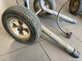 a wheel that is attached to a cart on the floor