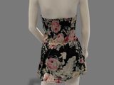 the mannequin is wearing a black and pink floral dress