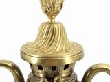 a blue and gold vase with a gold lid
