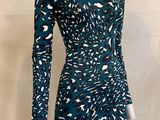 a mannequin mannequin dress with long sleeves and a long neckline