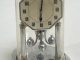 a glass dome with a clock inside of it