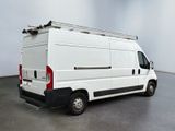 a white van that is parked in a room