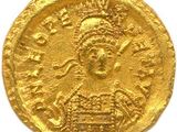une pièce d'or à l'effigie d'une femme