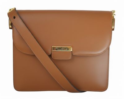 a brown leather cross body bag with gold hardware