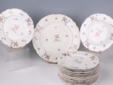 several plates are stacked on top of each other in front of a gray wall