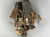 an image of a voodoo doll with many items on it