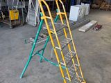 a ladder that is sitting in the middle of a building