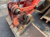 a red bulldozer that is sitting on the ground