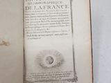 an open book with a picture of an eye on it