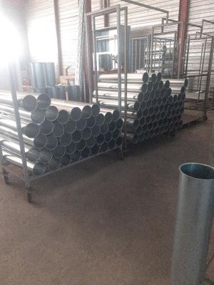 pipes are stacked up in a warehouse with a lot of them