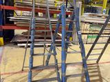 many ladders that are sitting in a warehouse