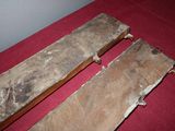 two pieces of wood that are sitting on a table