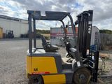a forklift that is sitting in the dirt