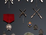 many different types of medals and medals on display