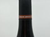a bottle of wine that is sitting on a table