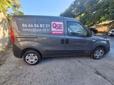 a grey van parked on the side of a road