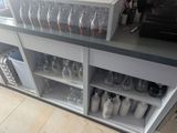 a counter with a bunch of empty bottles on it