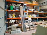 a room with a ladder, shelves, and other items in it