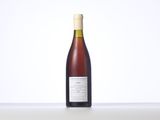 a bottle of wine that is sitting on a table