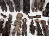 a lot of wooden carvings on a white surface