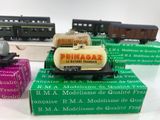 three model trains sitting on top of each other on a table