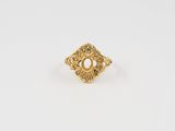 an image of a gold ring with a pearl in the center