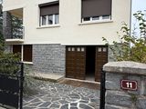 an image of a house with a gate in front of it