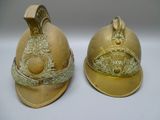 two helmets that are sitting next to each other