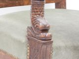 a wooden chair with green upholstered upholstered upholstered upholstered upholstered upholstered upholstered