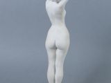 statue of a woman with her hands on her head