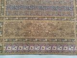 a close up of a rug on a bed with a white background