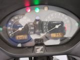 a close up of a speedometer on the dashboard of a motorcycle