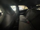 the back seats of a car are empty in a parking lot