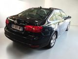 a picture of a black car parked in a garage