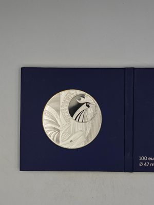 a close up of a book with a picture of a bird on it