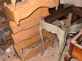 several pieces of furniture are stacked on top of each other in a room