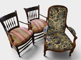 three chairs with floral upholstered cushions are sitting next to each other