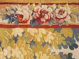 a close up of a rug with flowers on it