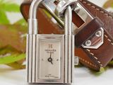 a watch with a padlock attached to it