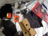 a pile of clothing and other items in a bag