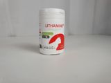 le flacon de vitamines est posé sur une surface blanche