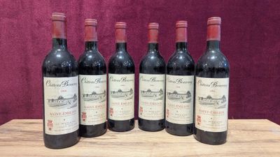 six bottles of red wine are lined up on a wooden table